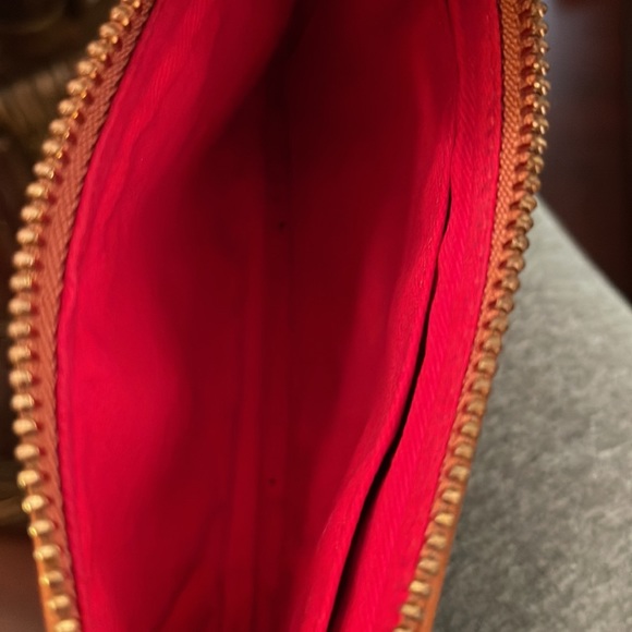 Dooney &Bourke wristlet pre owned has some flaws that are showed in pictures. - Picture 5 of 13